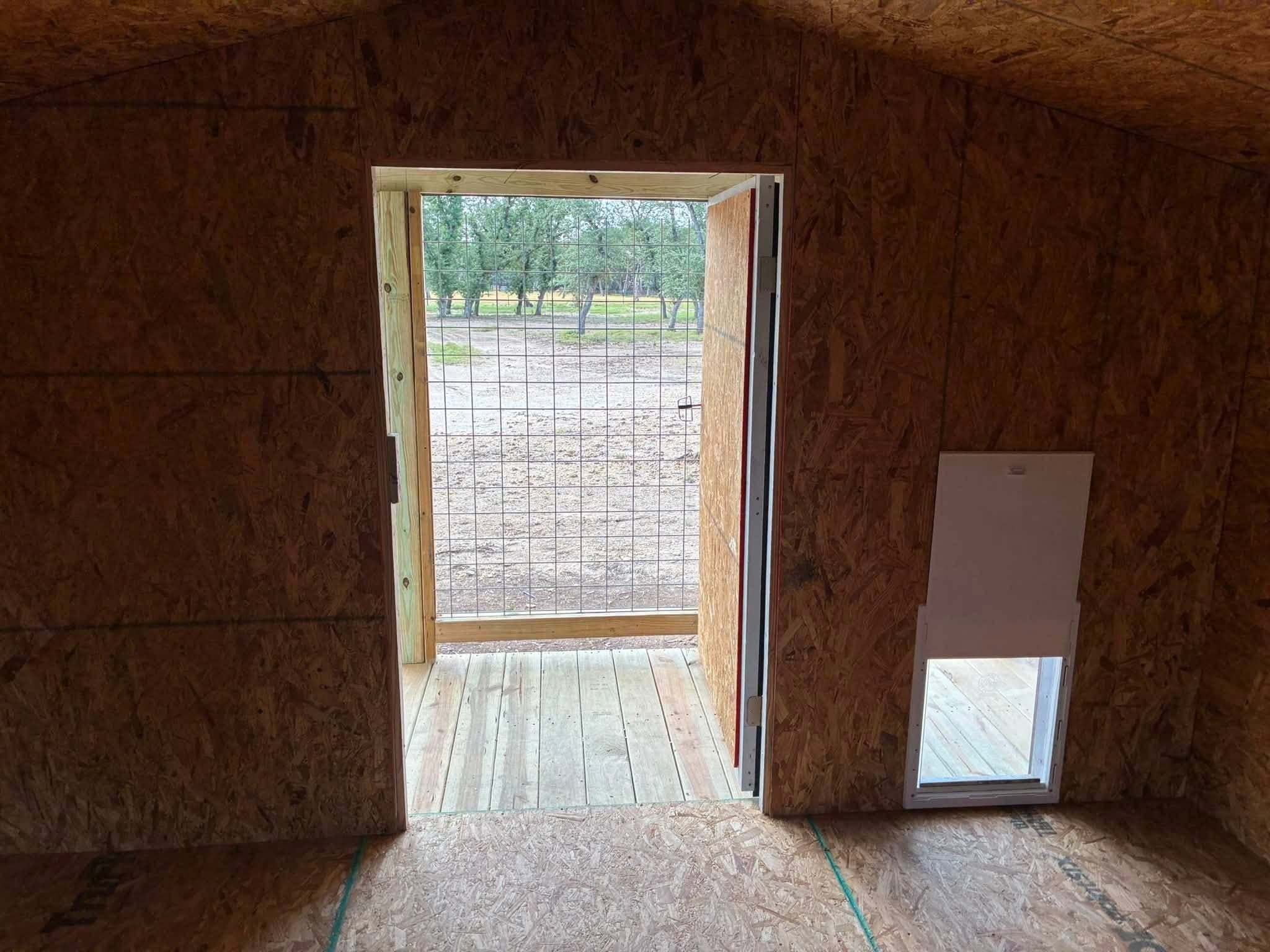 Interior view from the doghouse toward the 4x12 enclosed porch and pet door