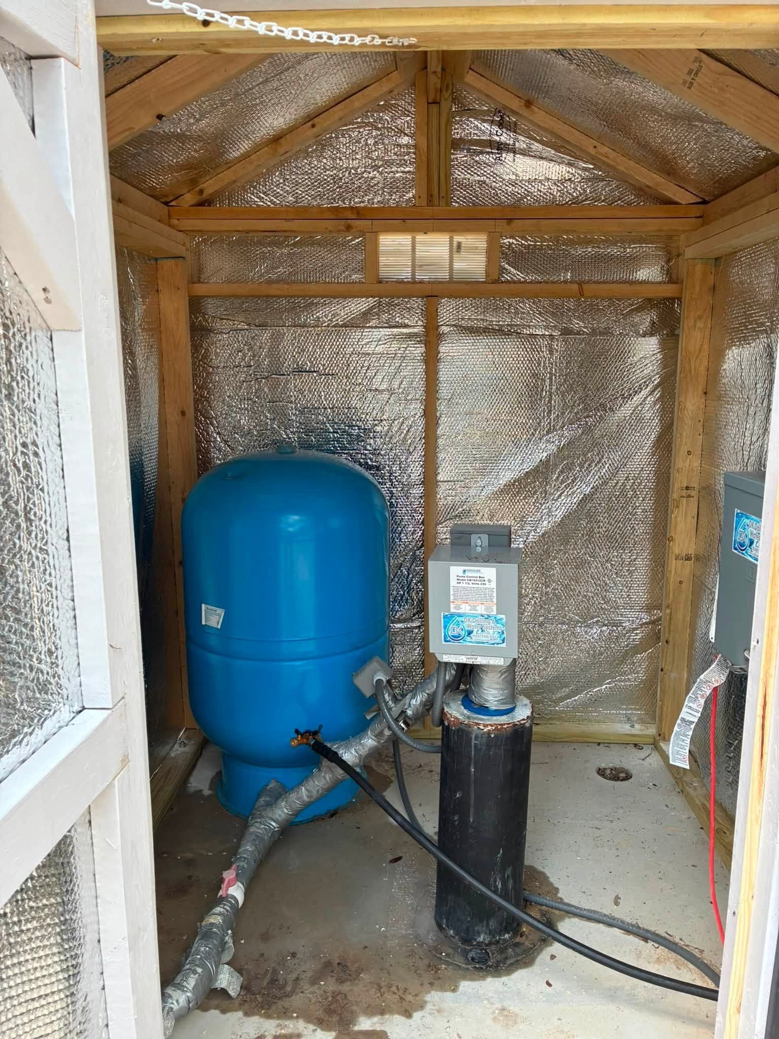 Interior of the watershed showing radiant-barrier insulation and protected water equipment